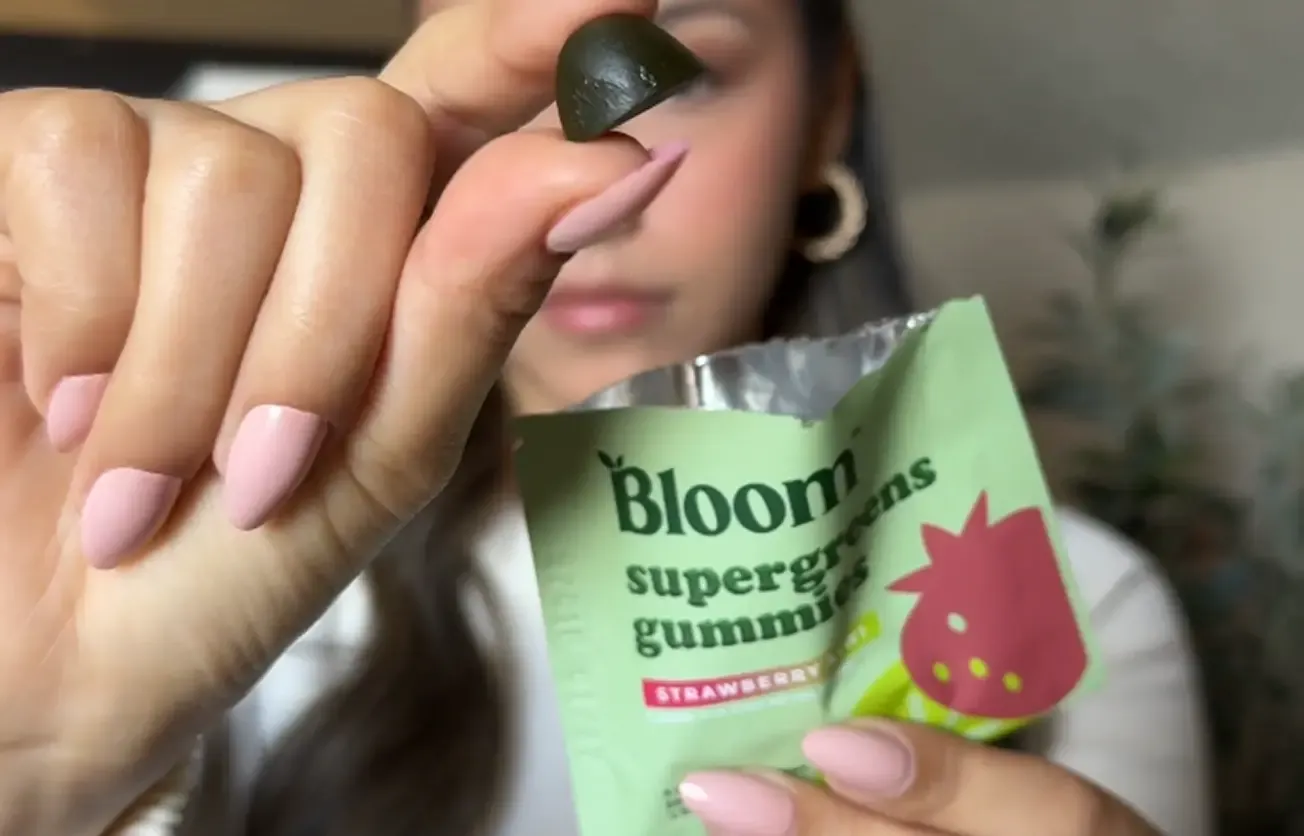 Creator presenting Bloom Nutrition products to camera