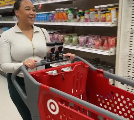 Creator pushing a Target cart down a store aisle