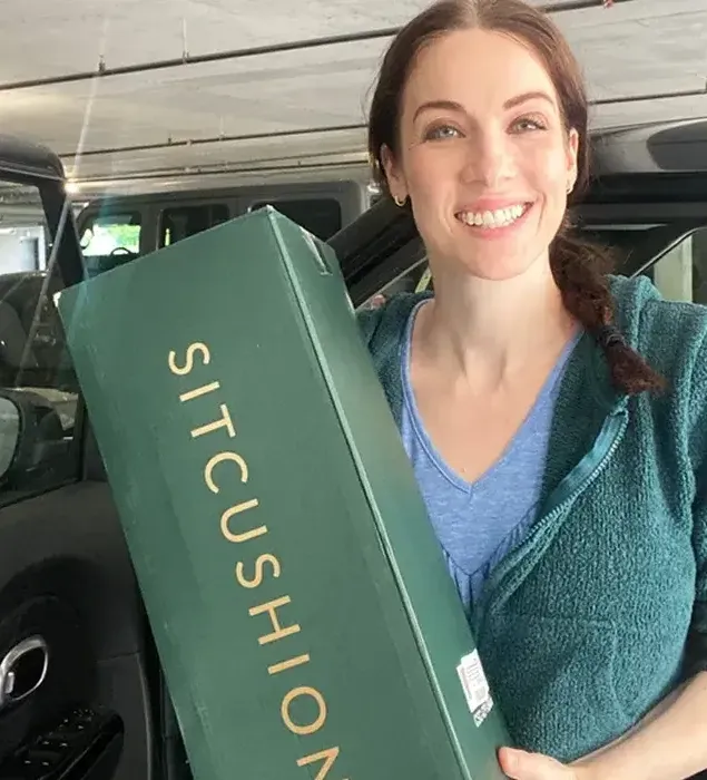 Creator holding the seat cushion packaging
