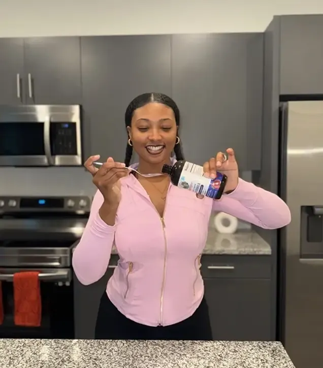 Creator holding MaryRuth Organics supplements