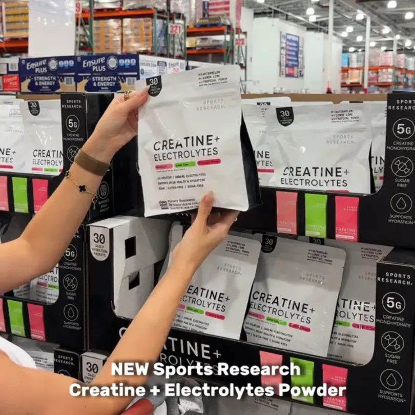 Creator picking a Sports Research Creatine + Electrolytes pouch off a Costco shelf