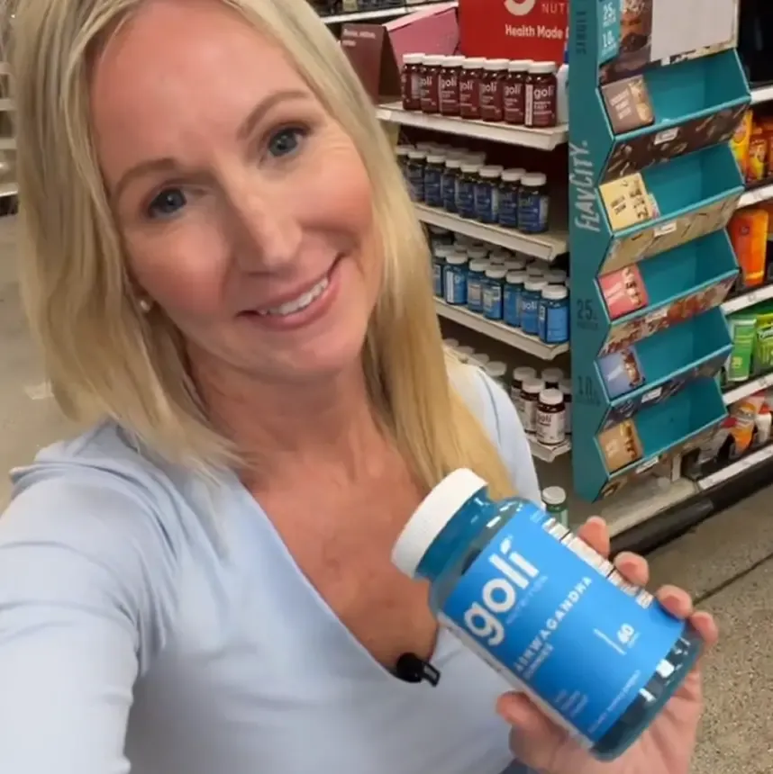 Creator holding Goli gummies in a Target store aisle