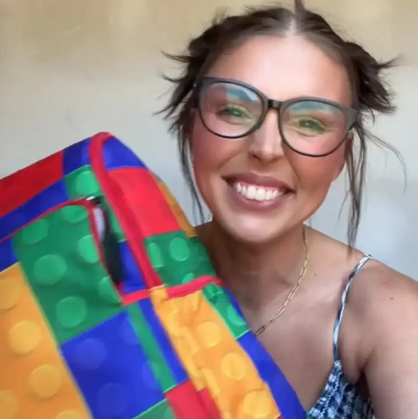 Creator holding a Harbor Creek gift product